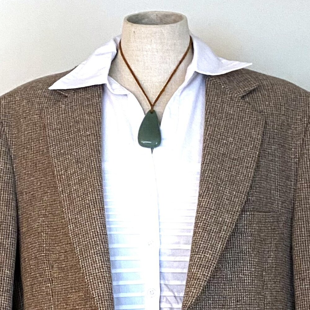 Green Gemstone Pendant on a Brown Ribbon Necklace